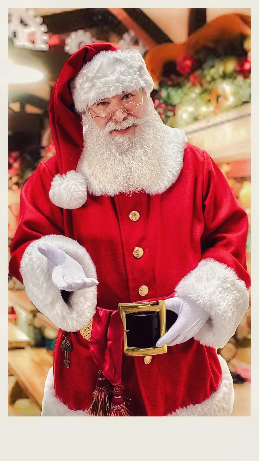 Santa Stu wearing his traditional red Christmas suit